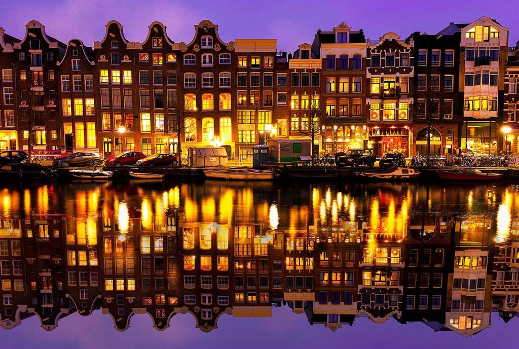 The welcoming lights of the houses facing Amsterdam's canals.